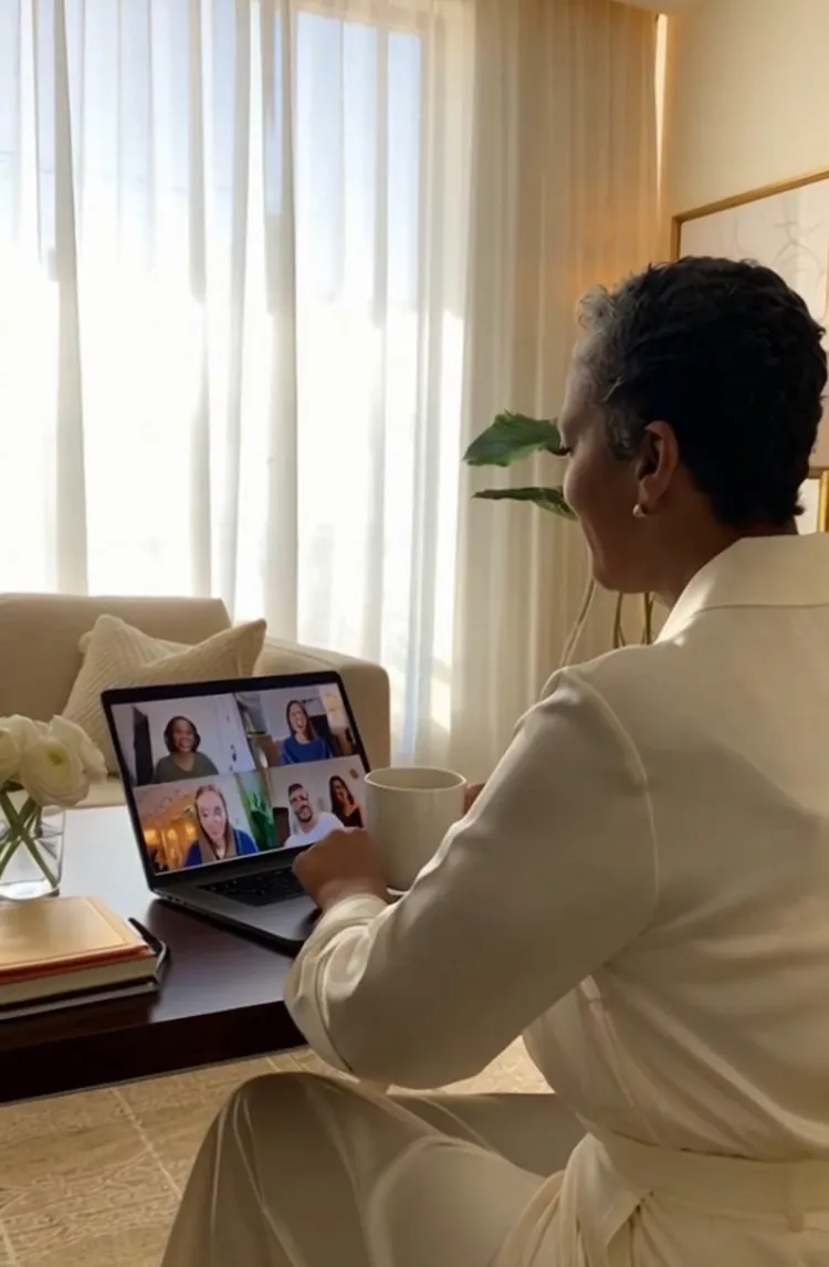 Caregiver joining a virtual meeting on a laptop